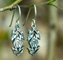 silver tao-tao earrings